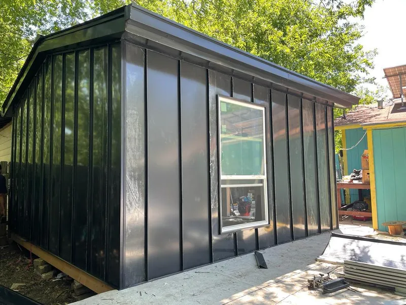 Black standing seam metal wall panels for Roof Inspection in Fenton