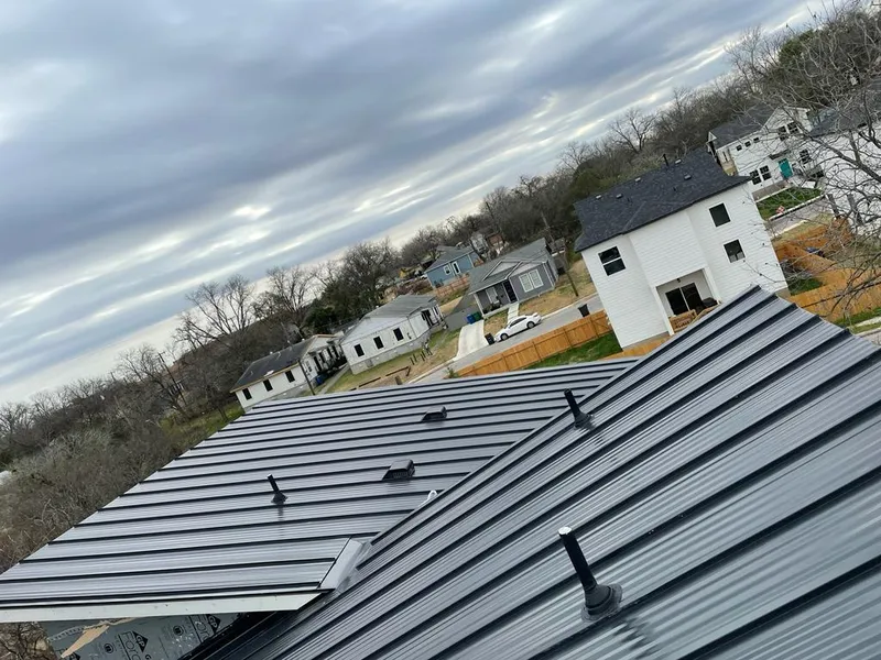 Standing seam metal roof panels with vents for Skylight Repair in Fenton